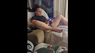 Fat White Chick playing movie games with her skirt up so you can peek at her panties (self perspective)