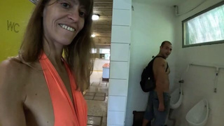 MILF in the public restrooms of a rest area is looking for a daddy to spunk in her fine twat