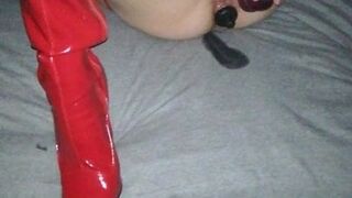 Red boots and a dildo
