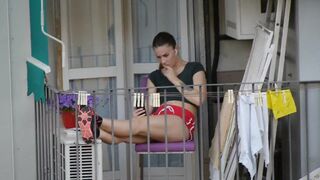 Candid girl relaxing on the balcony